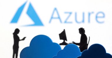 3D printed clouds and figurines are seen in front of the Microsoft Azure cloud service logo in this illustration taken on Feb. 8, 2022. (Reuters Photo)