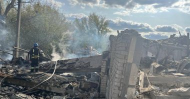 Firefighters work at the site of a Russian military strike in the village of Hroza, in Kharkiv region, Ukraine, Oct. 5, 2023. (Reuters Photo)