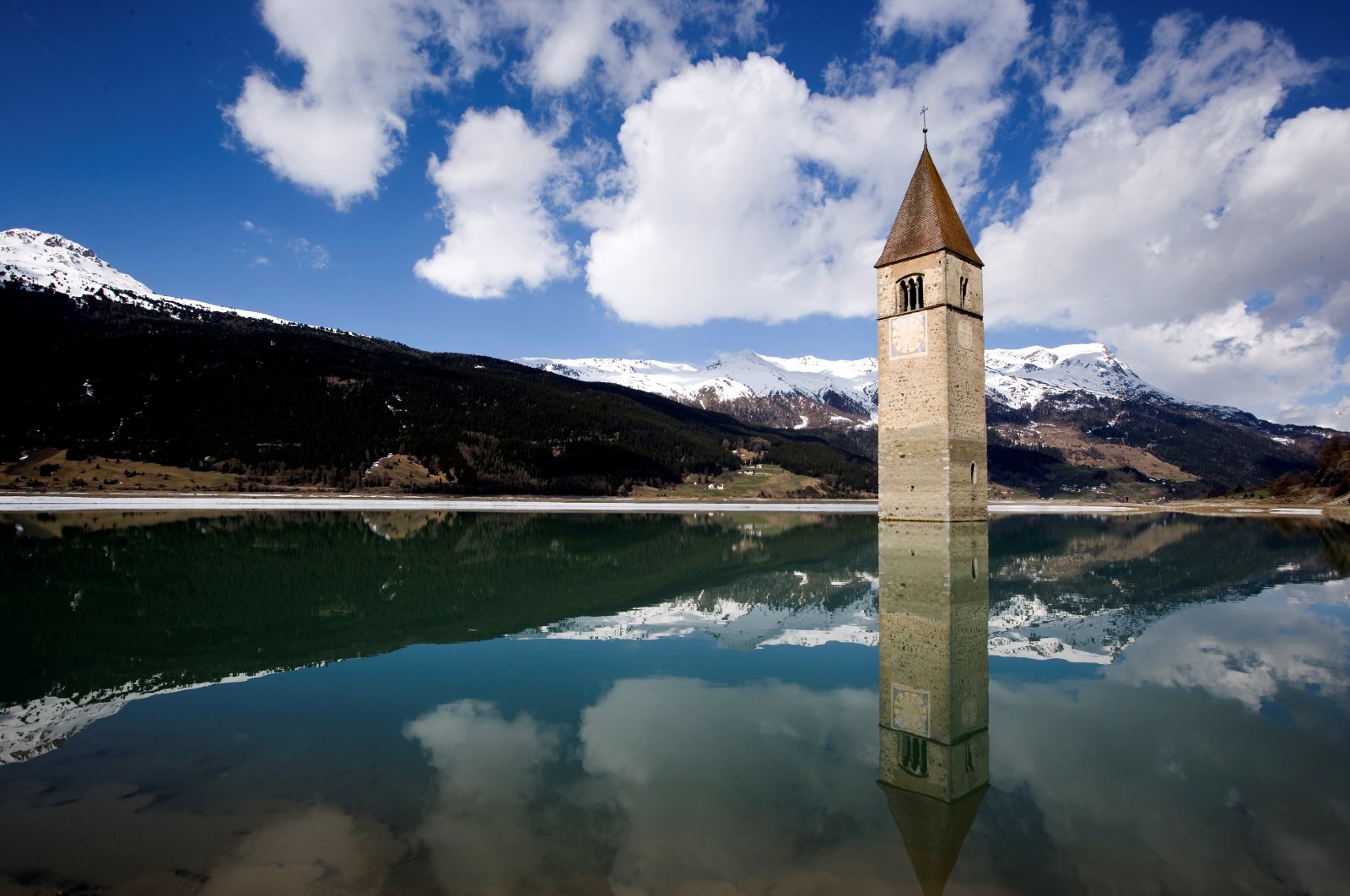 The bell tower in Reschense, Curon Venosta, Italy, April 23, 2006. (Getty Images Photo)