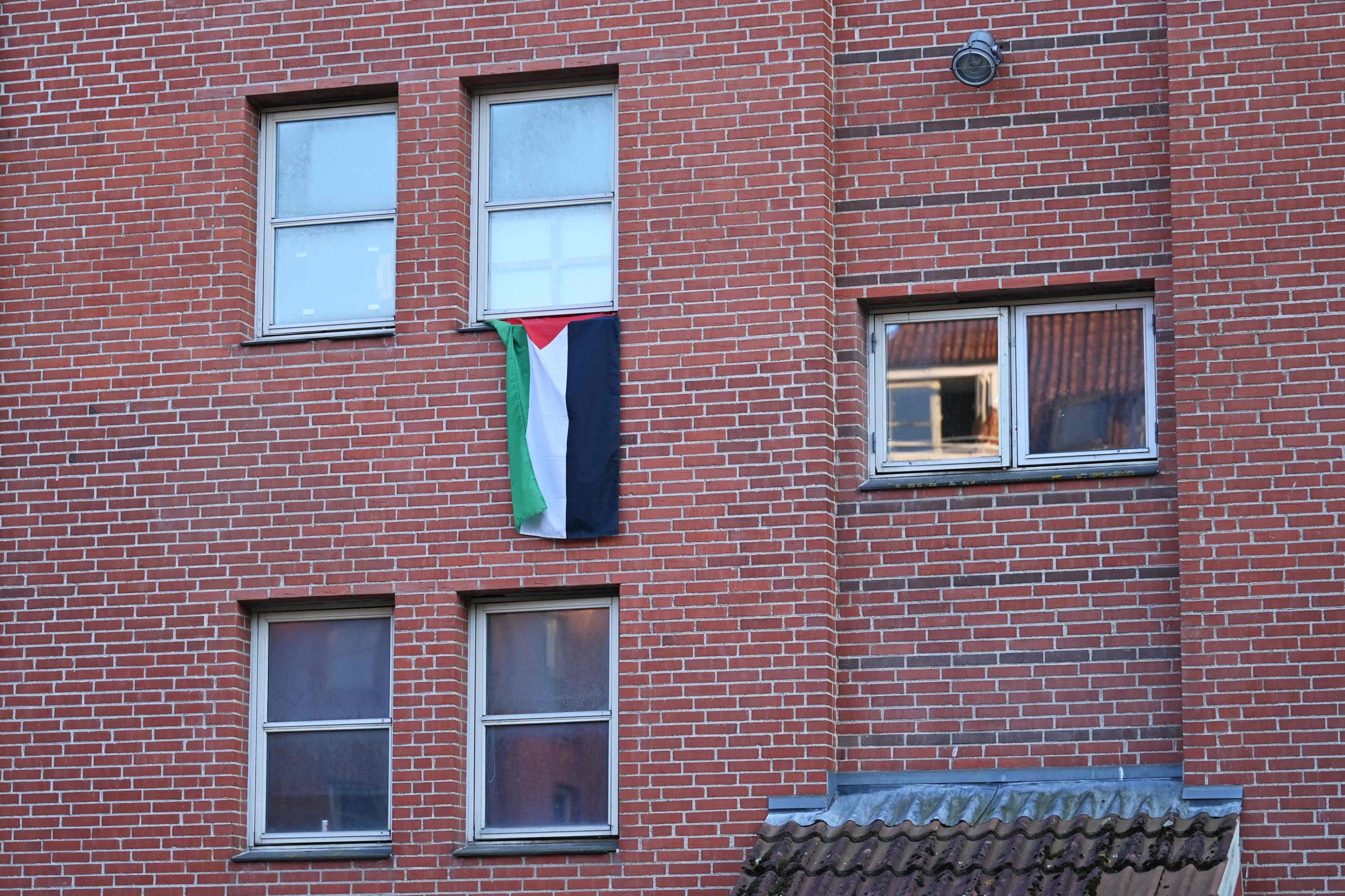 A Palestinian flag is seen hanging out of a window in the courtyard of Mjolnerparken housing estate in Copenhagen, Denmark, Aug. 28, 2023. (AFP Photo)