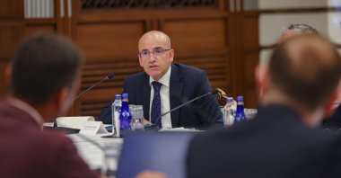 Treasury and Finance Minister Mehmet Şimşek is photographed during a meeting with reporters in the capital Ankara, Türkiye, Sept. 7, 2023. (AA Photo)