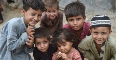 Afghan children pose for photos at an Afghan refugee camp in Karachi, Pakistan, Sept. 21, 2023. (AFP Photo)