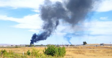 An explosion is seen in the Qamishli district in northern Syria, controlled by the terrorist PKK's offshoot YPG, Oct. 5, 2023. (DHA Photo)