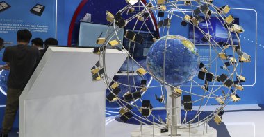 Visitors examine the Space Industry exhibition at the 74th International Astronautical Congress in Baku, Azerbaijan, Oct. 5, 2023. (EPA Photo)