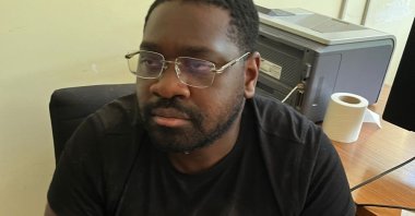 Interpol-wanted Isaac Bignan, known as the “Black Mamba,&quot; waits in police custody, Muğla, Türkiye, July 4, 2023. (DHA Photo)