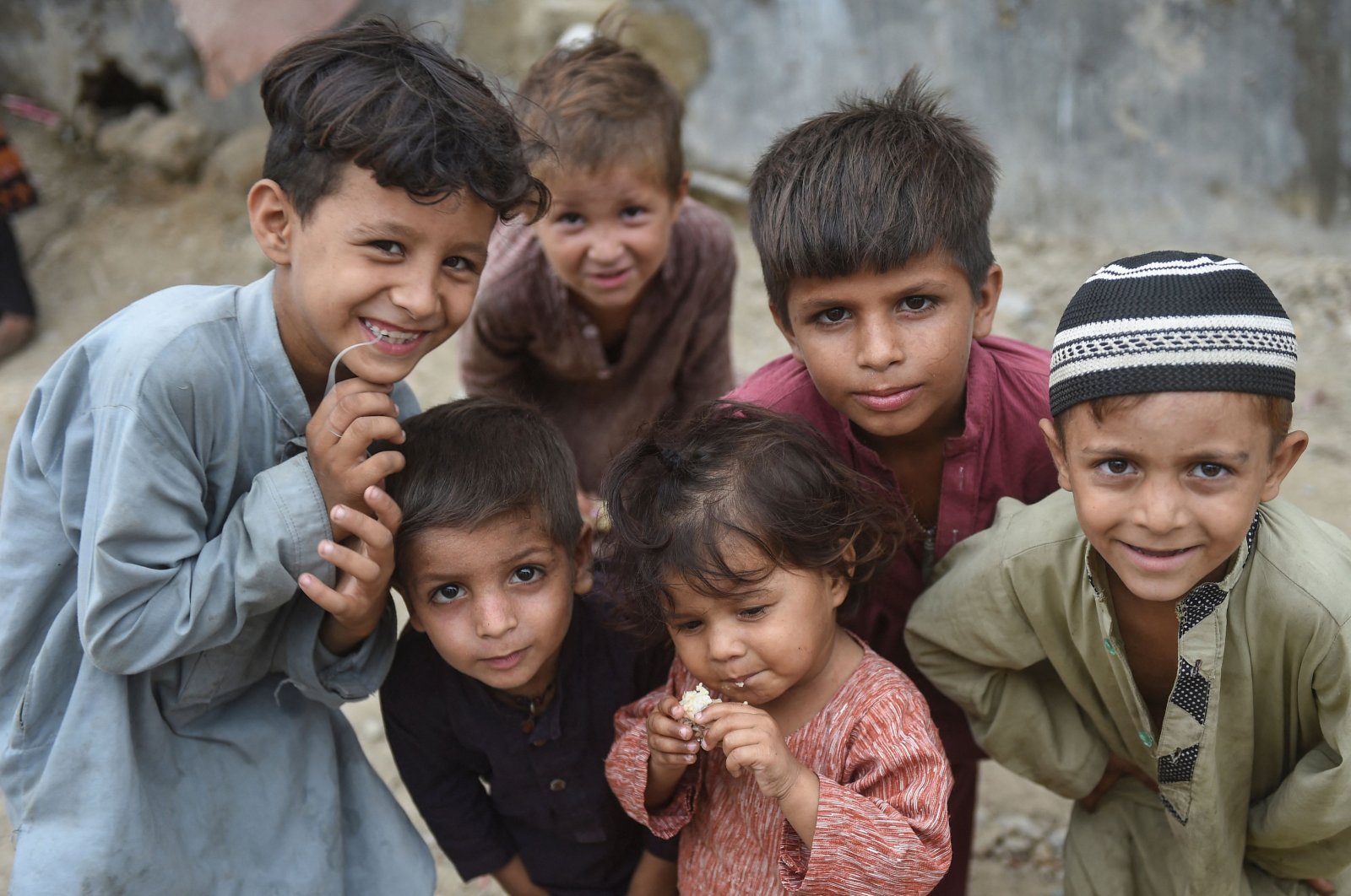 Afghan children pose for photos at an Afghan refugee camp in Karachi, Pakistan, Sept. 21, 2023. (AFP Photo)