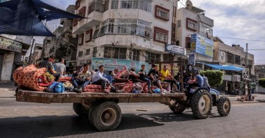 Palestinians flee Gaza City following Israeli air strikes on Oct. 7, 2023. (AFP Photo)