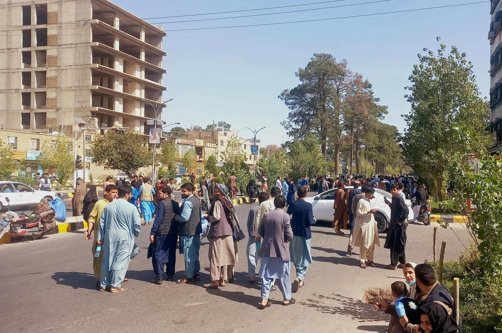 People gather on the streets in Herat following triple quakes, Oct. 7, 2023. (AFP Photo)