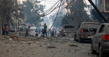 Residents check the damage following Israeli air strikes in Gaza City early on October 8, 2023. (AFP Photo)