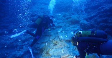 Divers are photographed along Kumluca Middle Bronze Age shipwreck, dubbed as one of the &quot;oldest known shipwrecks,&quot; Antalya, southern Türkiye, Oct. 6, 2023. (AA Photo)