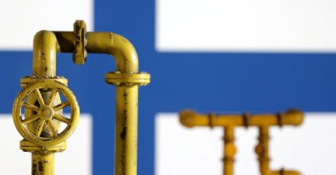 Model of natural gas pipeline and Finland flag, July 18, 2022. (Reuters Photo)