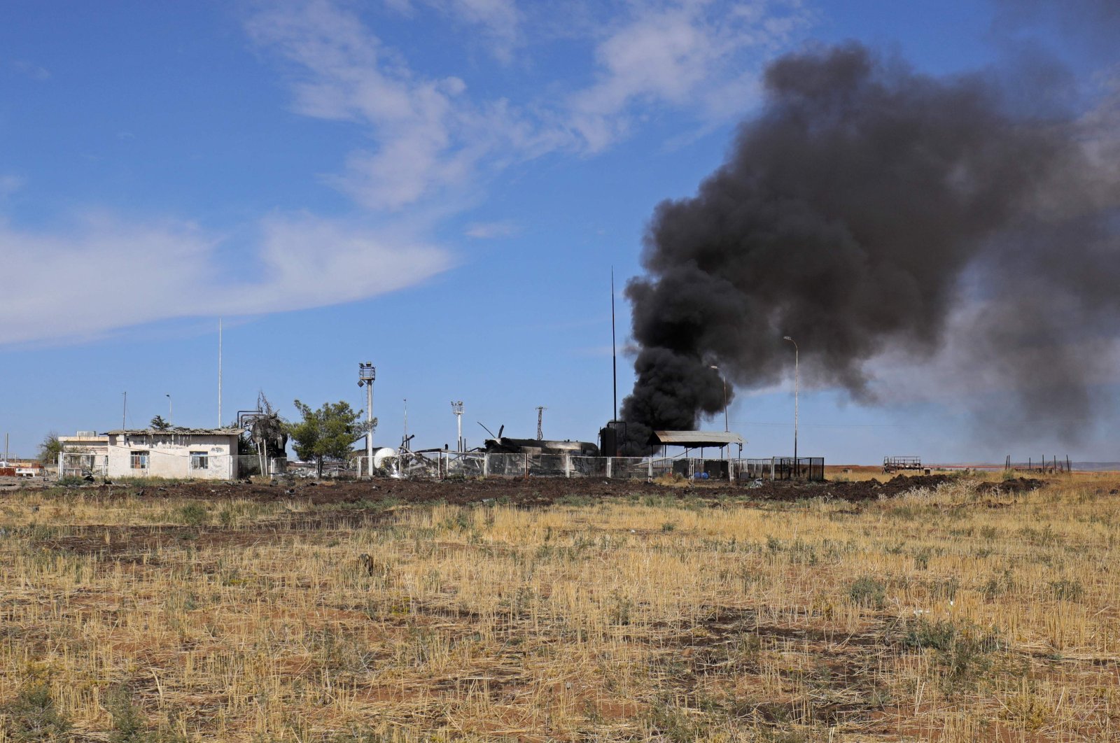 Smoke billows from the Basbasi oily facility following a Turkish strike in the countryside of al-Qahtaniya in Syria&#039;s PKK/YPG-controlled northeastern Hassakeh province, Syria, Oct. 6, 2023. (AFP Photo)