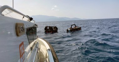 A Turkish Coast Guard Command boat approaches a boat of irregular migrants, off the coast of Datça, Muğla, southwestern Türkiye, Oct. 8, 2023. (İHA Photo)