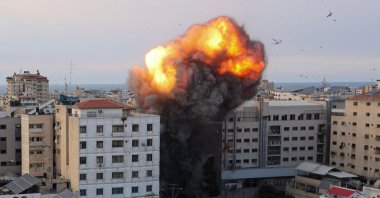 Fire and smoke rise after an Israeli airstrike targeted the National Bank in the Gaza Strip, Palestine, Oct. 8, 2023. (AFP Photo)