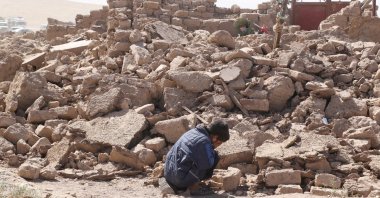 A boy cries as he sits next to debris, in the aftermath of an earthquake in the district of Zendeh Jan, Herat, Afghanistan, Oct. 8, 2023. (Reuters Photo)