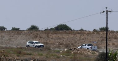United Nations vehicles passes inside the U.N. buffer zone at the village of Pile (Pyla), the island of Cyprus, Aug. 21, 2023. (AP Photo)