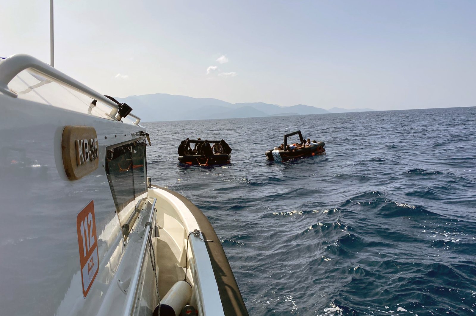 A Turkish Coast Guard Command boat approaches a boat of irregular migrants, off the coast of Datça, Muğla, southwestern Türkiye, Oct. 8, 2023. (İHA Photo)