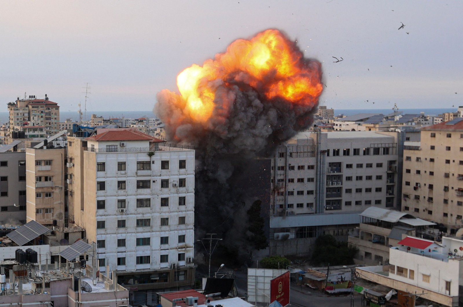 Fire and smoke rise after an Israeli airstrike targeted the National Bank in the Gaza Strip, Palestine, Oct. 8, 2023. (AFP Photo)