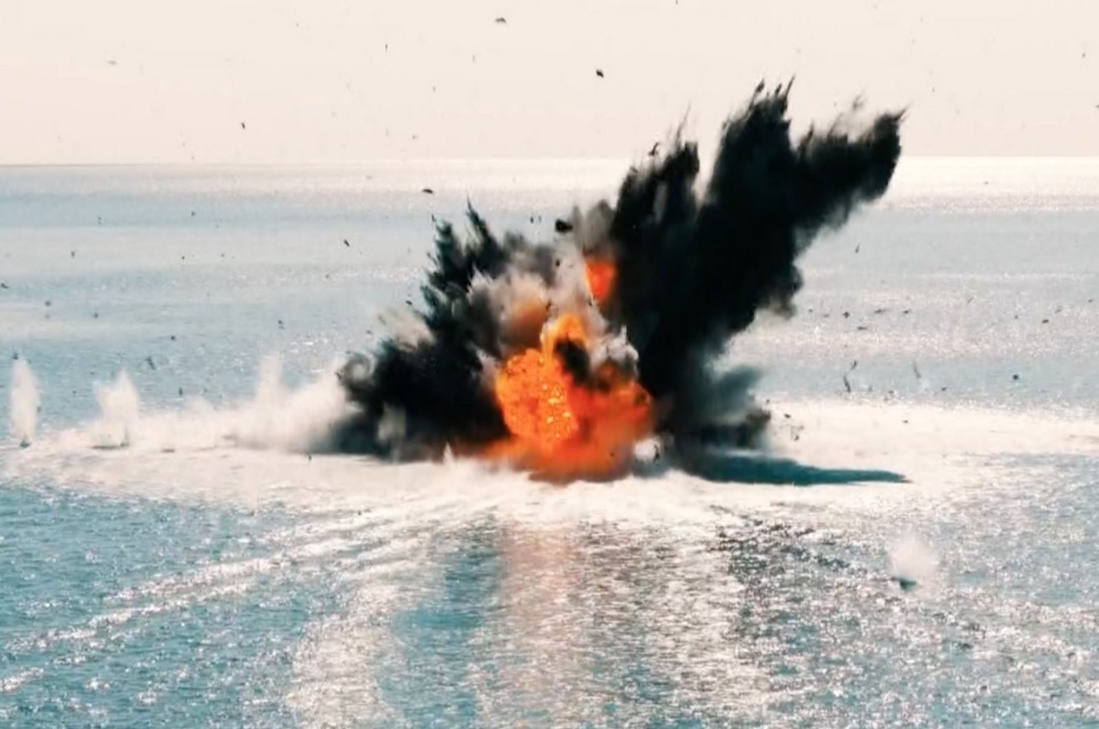 A ship explodes after being struck by Türkiye&#039;s unmanned surface vessel Albatros-S in a sea trial off Mersin, southern Türkiye, Oct. 9, 2023. (AA Photo)