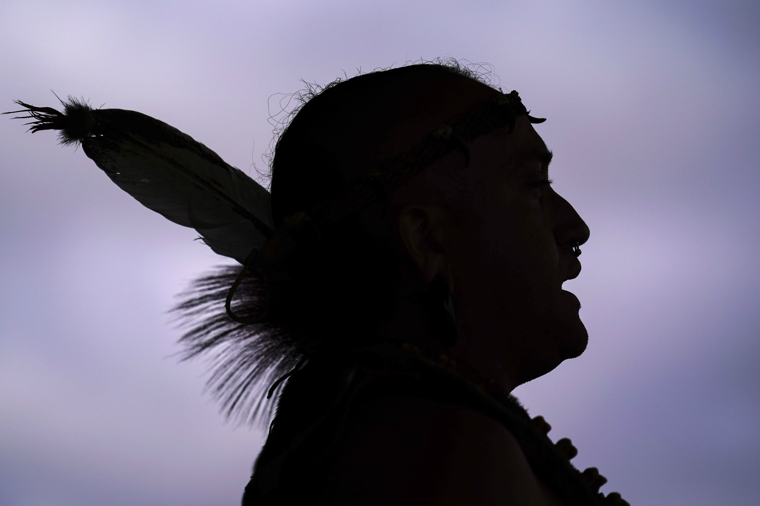 Tatanka Gibson of the Haliwa-Saponi/Nansemond Tribal Nations leads attendees in song and dance during a gathering marking Indigenous Peoples Day at Penn Treaty Park, Philadelphia, U.S., Oct. 11, 2021. (AP Photo)