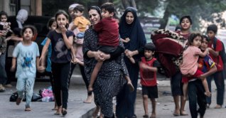 Palestinian women with their children flee from their homes following Israeli airstrikes on Gaza City, Palestine, Oct. 11, 2023. (AFP Photo)