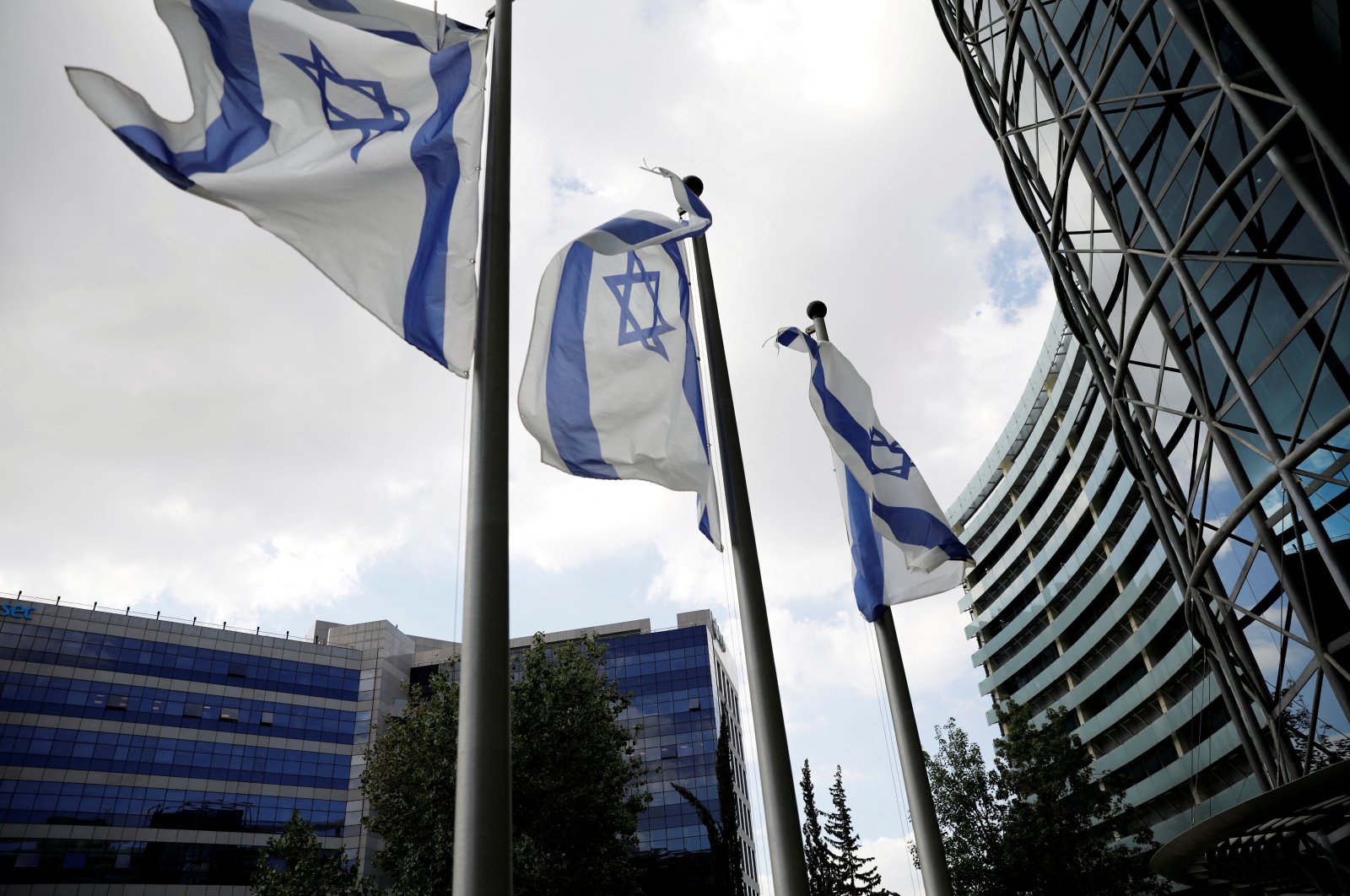 Israeli national flags flutter near office towers at a business park also housing high-tech companies, at Ofer Park in Petah Tikva, Israel, Aug. 27, 2020. (Reuters Photo)