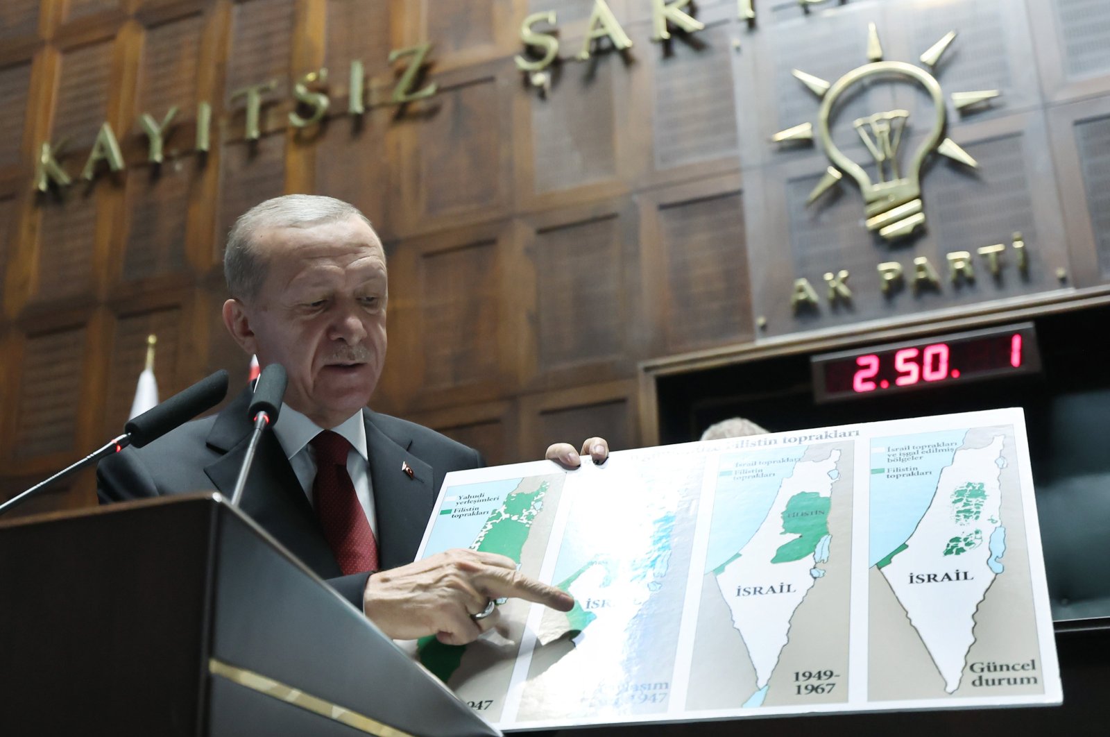 President Recep Tayyip Erdoğan shows a map of Palestinian territories occupied by Israel during his speech at the Justice and Development Party (AK Party) group parliamentary meeting in the capital Ankara, Türkiye, Oct. 11, 2023. (AA Photo)