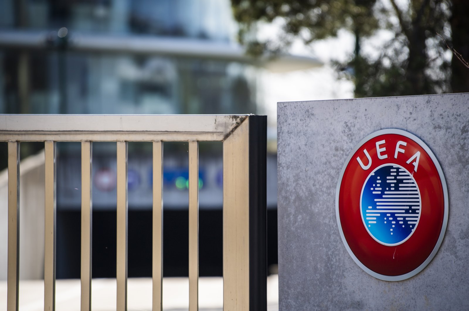 The UEFA logo is displayed near the entrance of the UEFA headquarters, Nyon, Switzerland, March 17, 2020. (AP Photo)