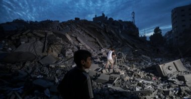 Palestinians inspect the destroyed surroundings of the Palestine Tower after Israeli warplanes targeted it in Gaza City, Palestine, Oct. 7, 2023. (EPA Photo)