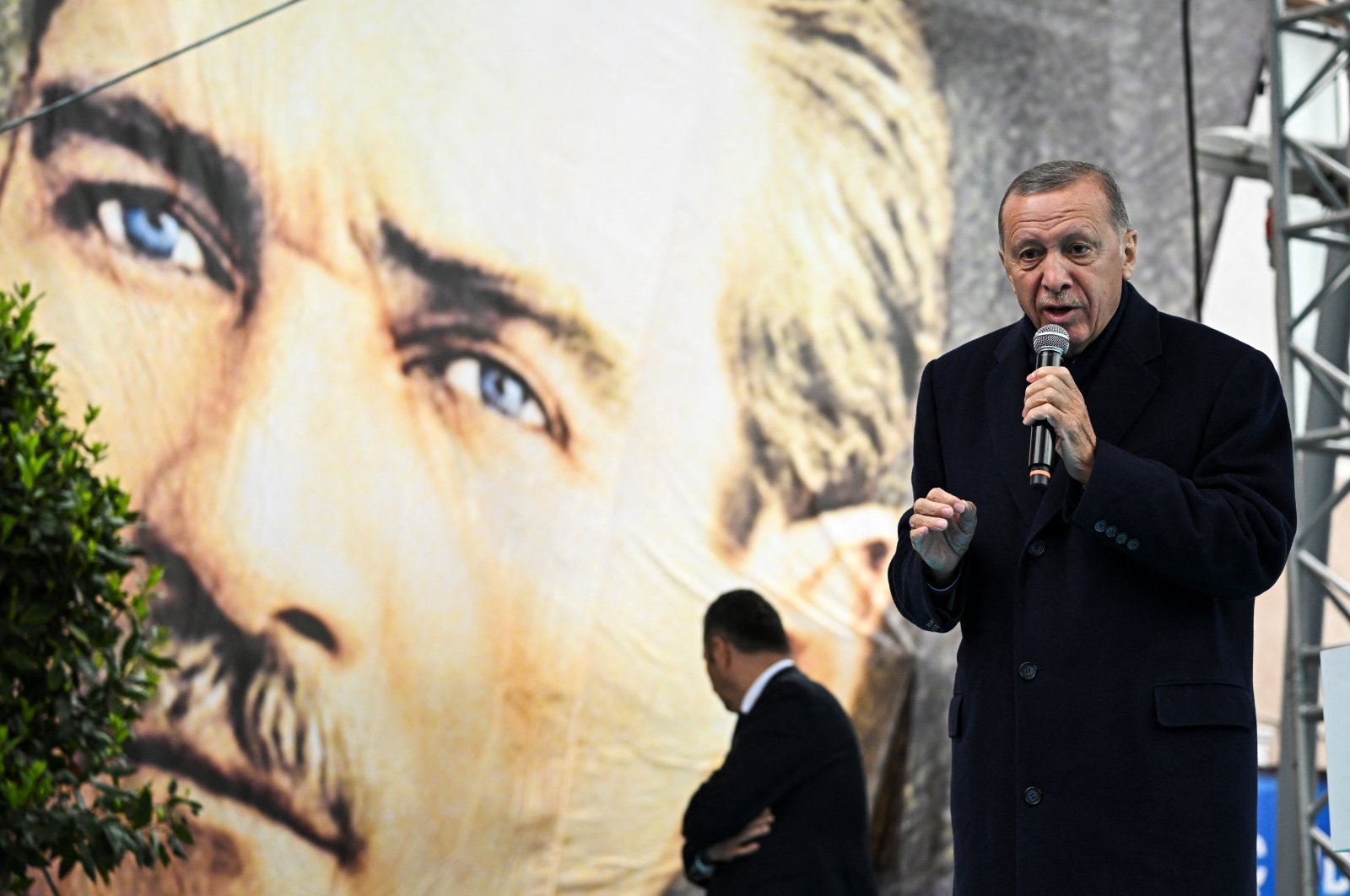 President Recep Tayyip Erdoğan addresses his supporters during a rally, in front of a poster of Mustafa Kemal Atatürk, the founder of modern Türkiye, ahead of the May 14 presidential and parliamentary elections, Istanbul, Türkiye, May 12, 2023. (Reuters Photo)