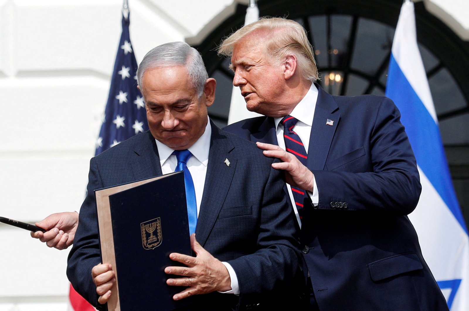 Israel&#039;s Prime Minister Benjamin Netanyahu stands with U.S. President Donald Trump after signing the Abraham Accords, normalizing relations between Israel and some of its Middle East neighbors, on the South Lawn of the White House in Washington, U.S., Sept. 15, 2020. (Reuters Photo)
