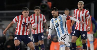 Argentina's forward Lionel Messi (R) and Paraguay's midfielder Richard Sanchez vie for the ball during the 2026 FIFA World Cup South American qualification football match between Argentina and Paraguay at the Mas Monumental stadium, Buenos Aires, Argentina, Oct. 12, 2023. (AFP Photo)