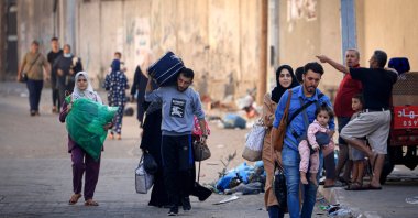 Palestinians with their belongings flee to safer areas in Gaza City after Israeli airstrikes, Gaza City, Palestine, Oct. 13, 2023. (AFP Photo)