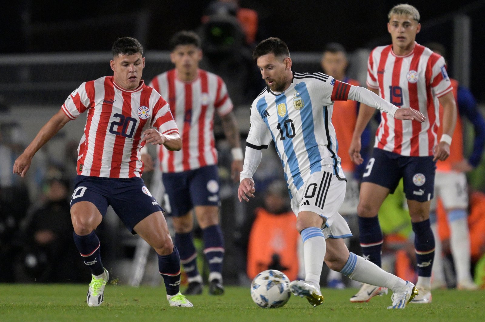 Argentina&#039;s forward Lionel Messi (R) and Paraguay&#039;s midfielder Richard Sanchez vie for the ball during the 2026 FIFA World Cup South American qualification football match between Argentina and Paraguay at the Mas Monumental stadium, Buenos Aires, Argentina, Oct. 12, 2023. (AFP Photo)