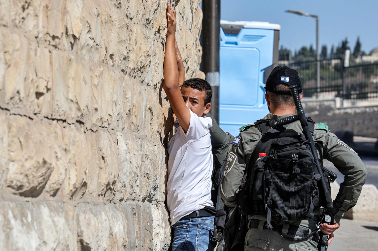 Israeli border guards search a Palestinian youth outside the Lion&#039;s Gate of the Old City, Jerusalem, Palestine, Oct. 13, 2023. (AFP Photo)