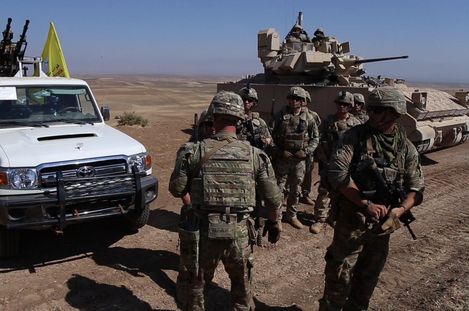 U.S. soldiers cluster as they conduct a joint military drill with PKK/YPG terrorists near the town of Qamishli in northeastern Hasakah province, Syria, Aug. 18, 2023. (AA Photo)