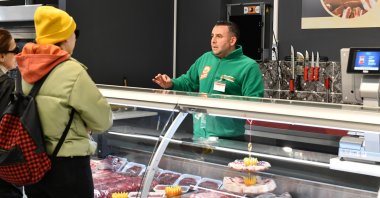 A customer shops at butcher in the capital Ankara, Türkiye, Sept. 22, 2023. (AA Photo)