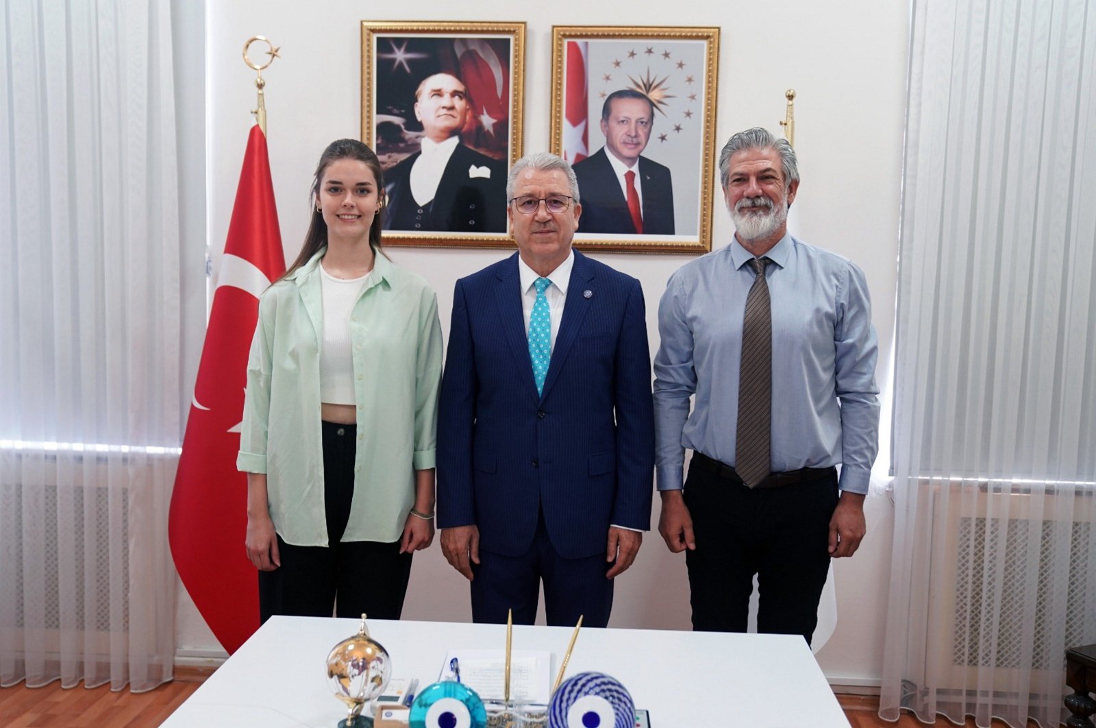 Professor Tolga Akşit (R) and Rector Necdet Budak (C) pose for a photo at Ege University, Izmir, Türkiye, Oct. 14, 2023. (AA Photo)