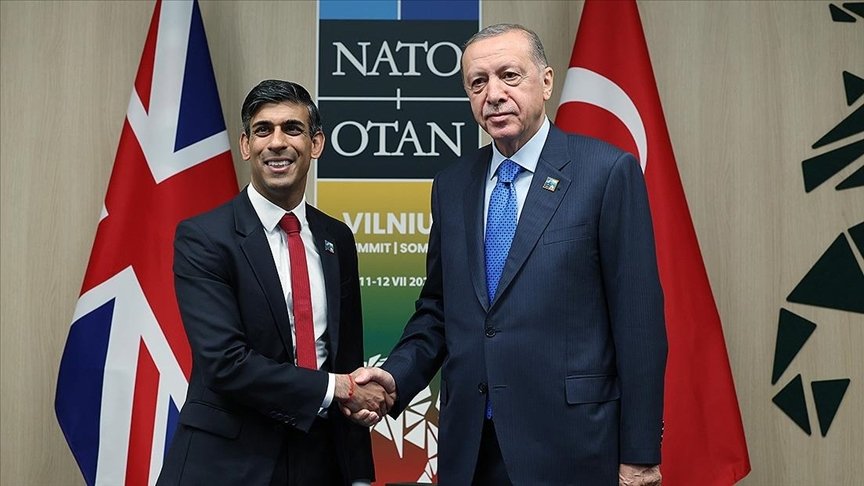 President Recep Tayyip Erdoğan (R) shakes hands with British Prime Minister Rishi Sunak during a meeting on the sidelines of a NATO summit in Vilnius, Lithuania, July 11, 2023. (AA Photo)