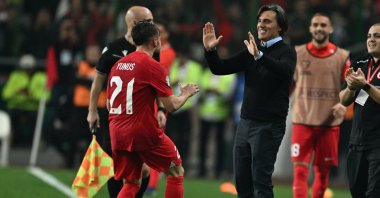 Türkiye&#039;s Italian head coach Vincenzo Montella (C) celebrates with Yunus Akgün (L) during the UEFA Euro 2024 Group D qualification football match against Latvia at the Konya Buyuksehir Belediye stadium, Konya, Türkiye, Oct. 15, 2023. (AA Photo)