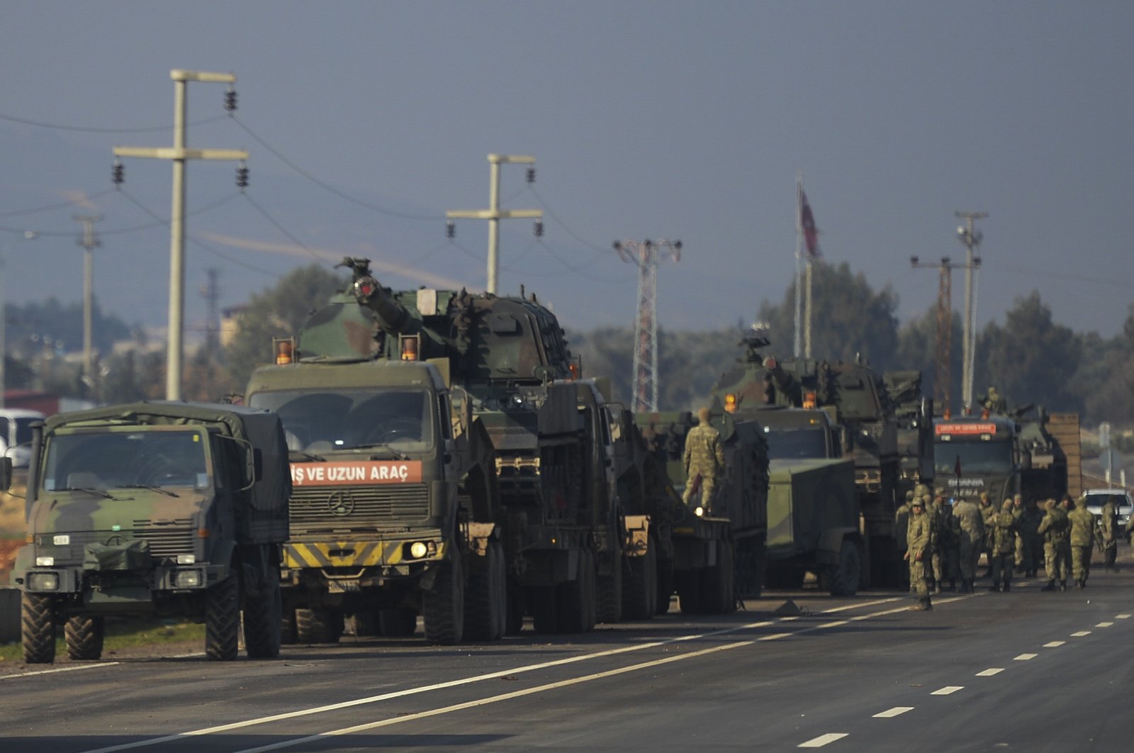 Turkish troops and artillery prepare to enter Syria, in Reyhanlı district of southern Hatay province, Türkiye, Feb. 14, 2020. (AP Photo)