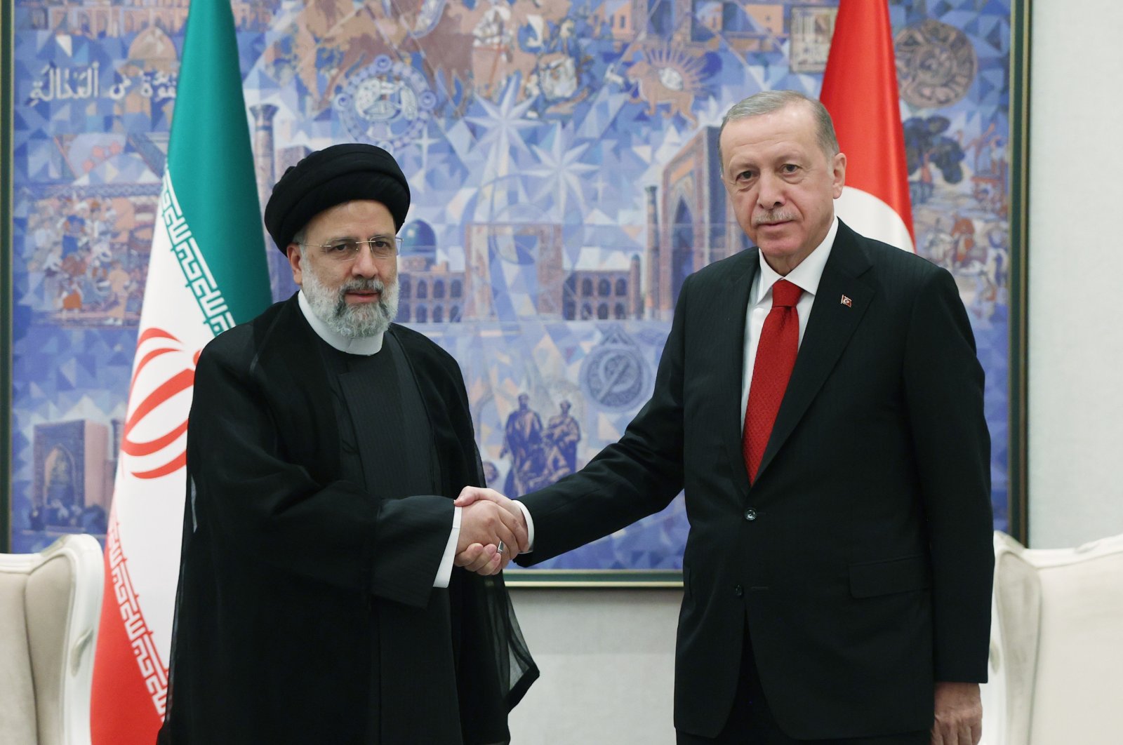 President Recep Tayyip Erdoğan shakes hands with Iranian President Ebrahim Raisi during a meeting in Samarkand, Uzbekistan, Sept. 17, 2022. (İHA Photo)