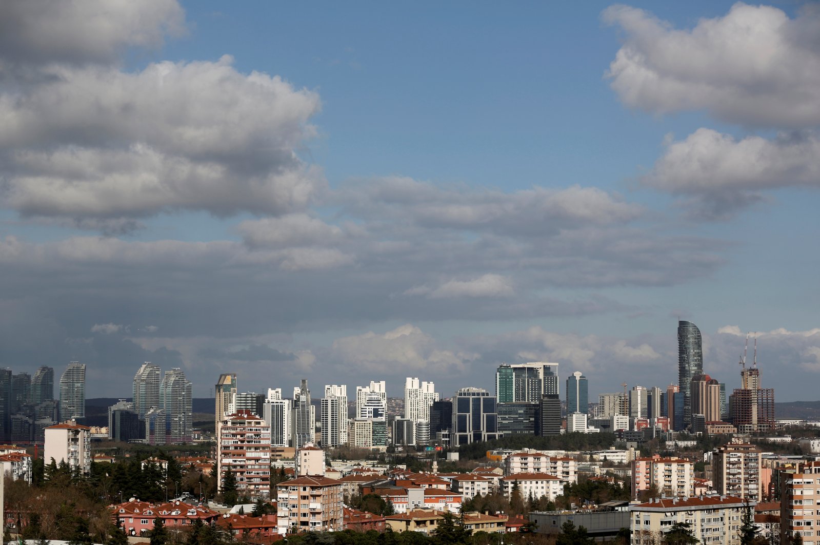 Skyscrapers in the Maslak business and financial district are seen behind the residential apartment blocks in Istanbul, Türkiye, Jan. 23, 2020. (Reuters Photo)