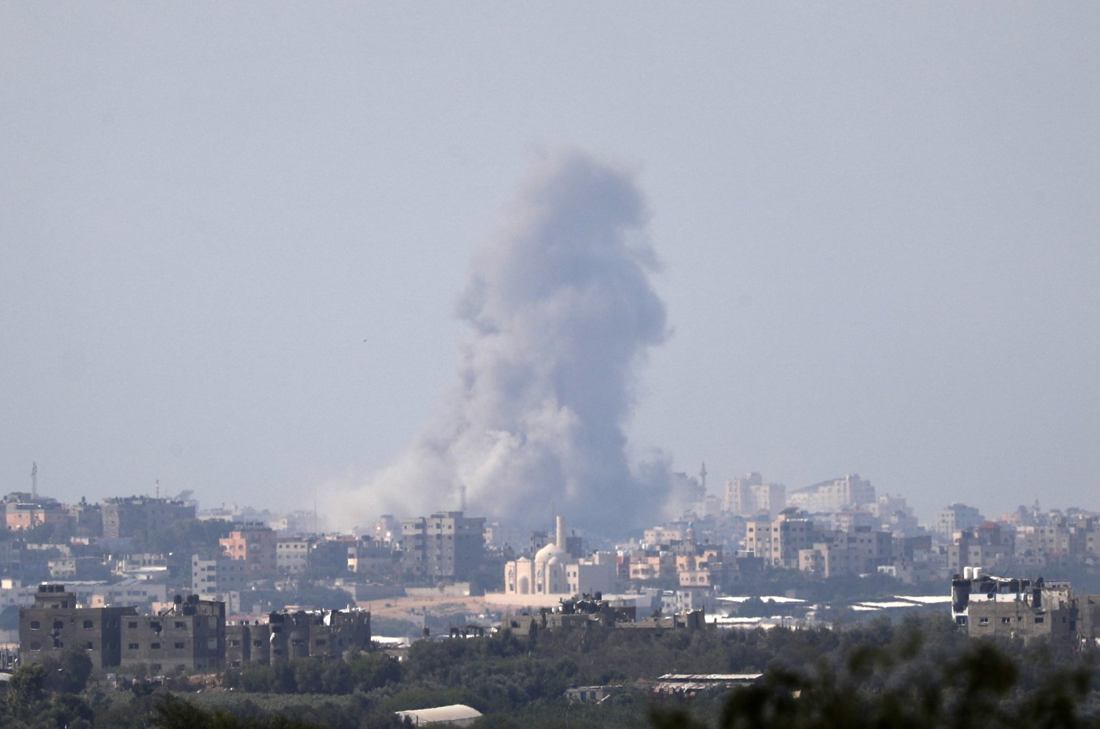 Clouds of smoke rise from the town of Beit Lahia as a result of Israeli airstrikes in northern Gaza, as seen from Israel&#039;s border with the Gaza Strip, Oct. 16, 2023. (EPA Photo)