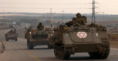 Israeli soldiers ride in their armored vehicles towards the border with the Gaza Strip, Palestine, Oct. 16, 2023. (AFP Photo)