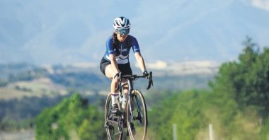 Turkish ceramics artist-turned-cyclist Ipek Alakuş rides along the streets of Istanbul, Istanbul, Türkiye, Oct. 14, 2023. (Photo by Serkan Ünlü)