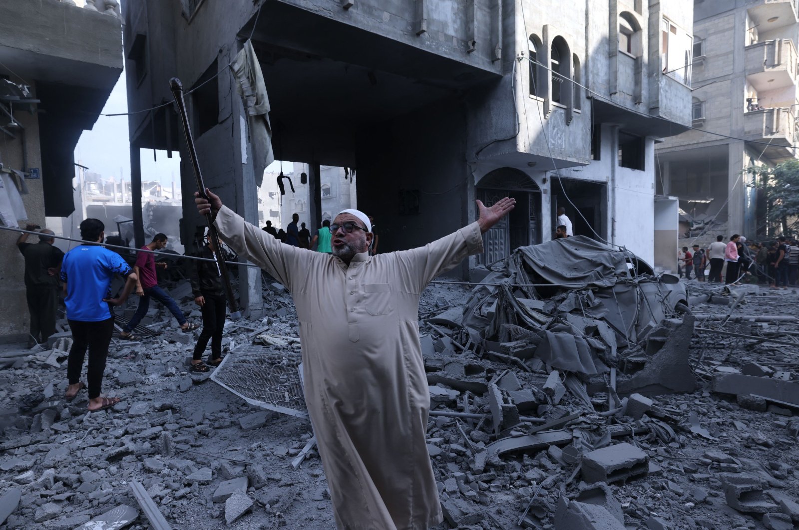 A Palestinian reacts amid the rubble of a building after an Israeli airstrike on the Rafah refugee camp, southern Gaza Strip, Palestine, Oct. 17, 2023. (AFP Photo)