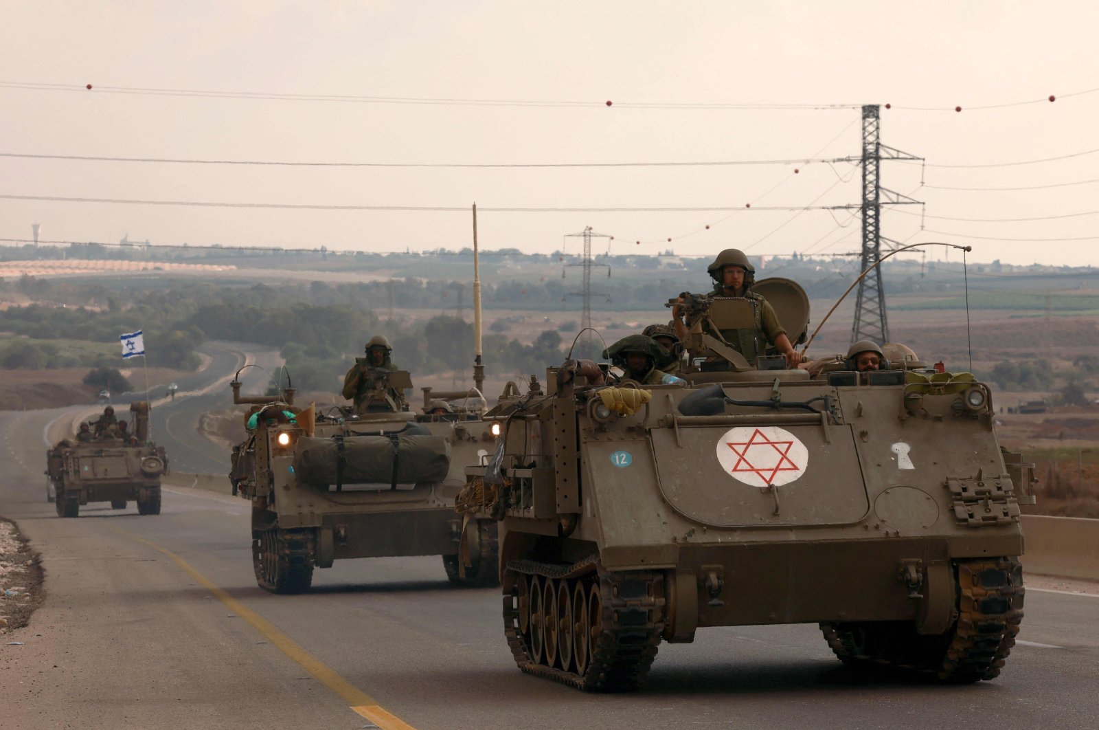 Israeli soldiers ride in their armored vehicles towards the border with the Gaza Strip, Palestine, Oct. 16, 2023. (AFP Photo)
