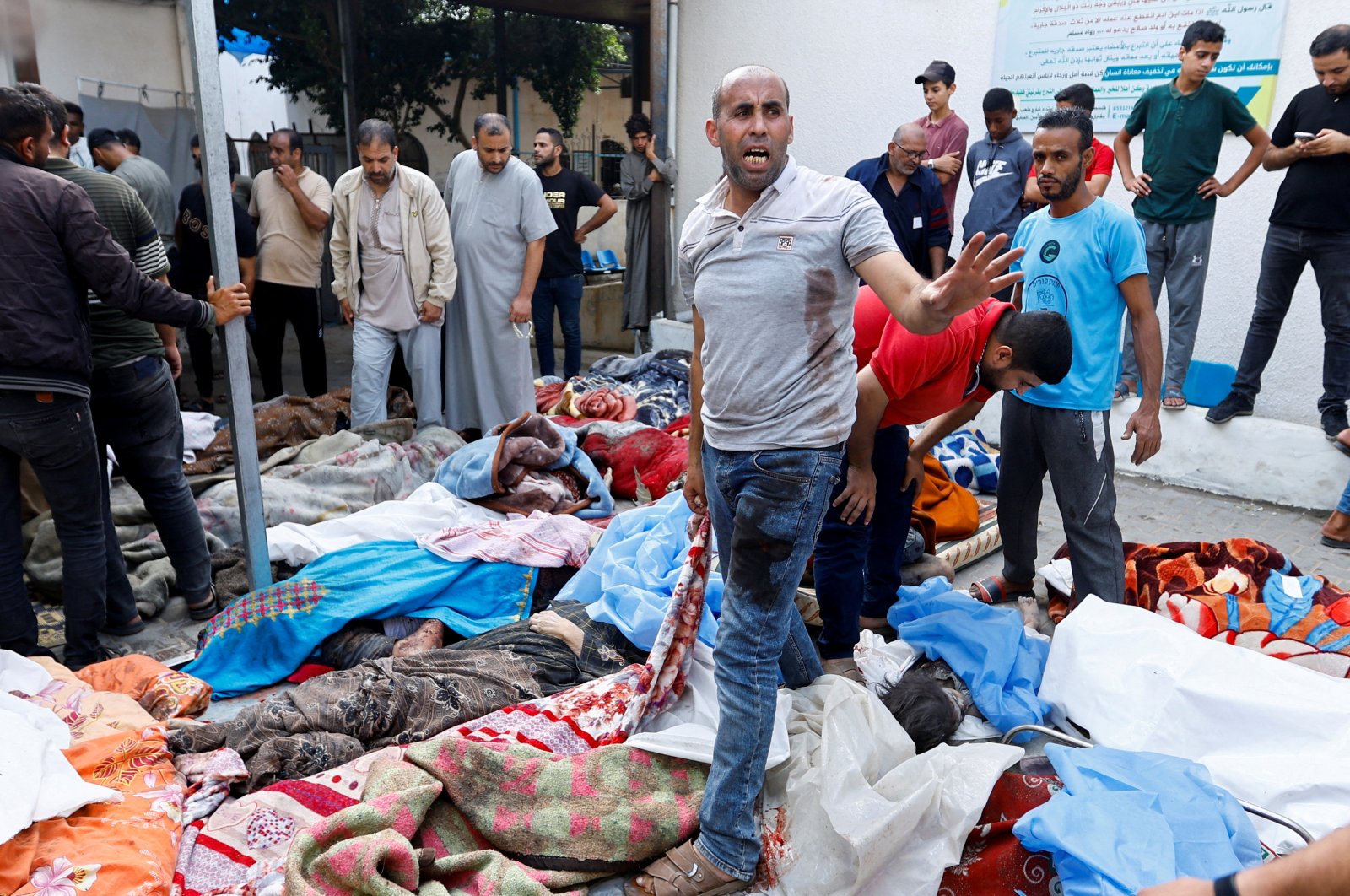 Bodies of Palestinians killed in Israeli strikes line the floor of a hospital in the southern Gaza Strip, Palestine, Oct. 17, 2023. (Reuters Photo)