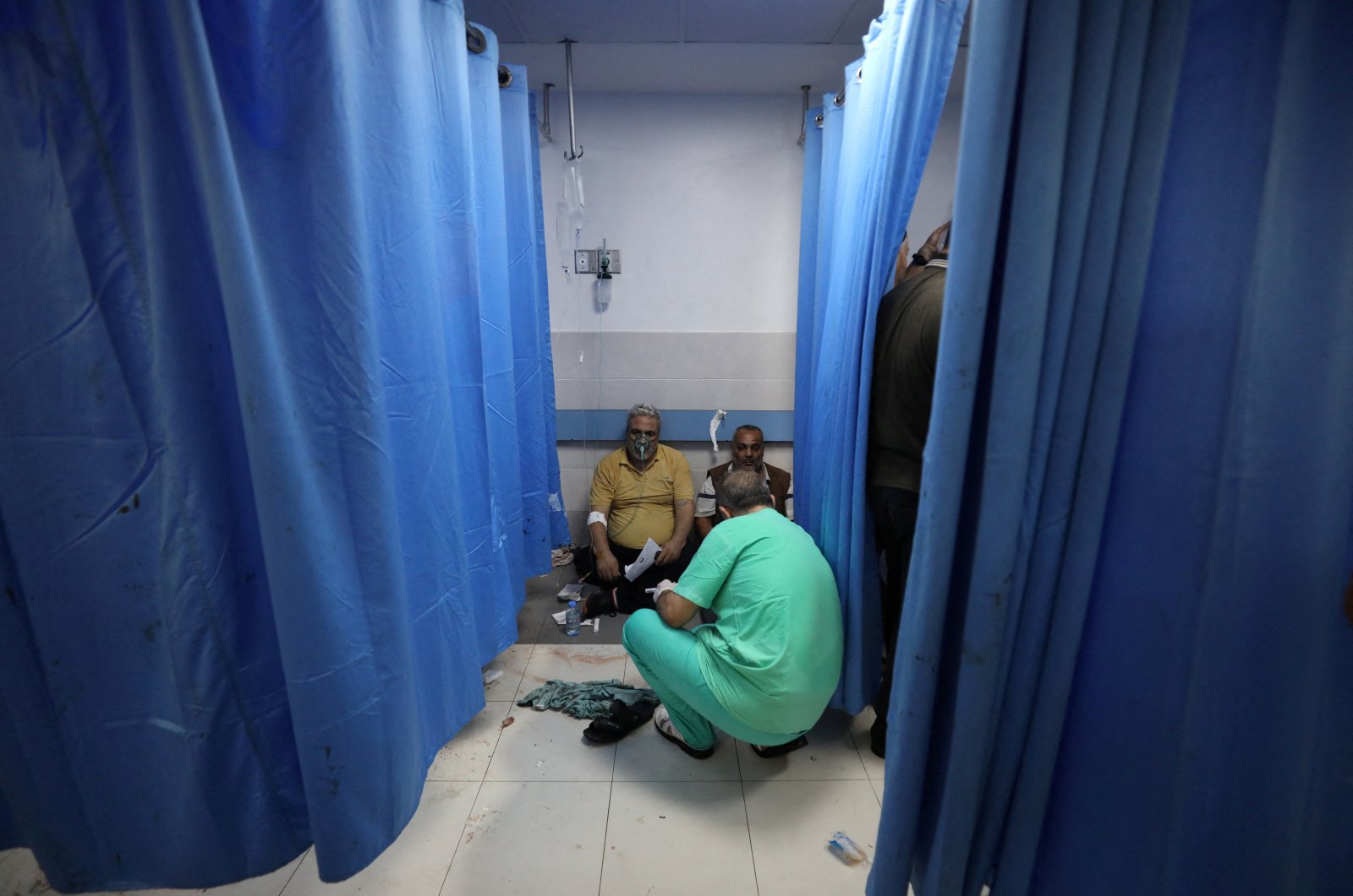 People are assisted at Shifa Hospital after an Israeli airstrike hit the nearby Al-Ahli Hospital, according to the Palestinian Health Ministry in Gaza City, Gaza Strip, Palestine, Oct. 17, 2023. (Reuters Photo)